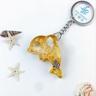 Hot sale Artificial luminious Dolphin shape resin amber craft keychain Foreign trade export key chain decorations