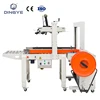 FXC5050A Carton sealer side belts box sealing packaging machine and DBA200 Automatic strapping machine