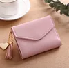 New Product Pure Color Wallets Heart-shaped Pendant Simple Fashion Multi-functional lychee PU leather Short Tassel Woman Wallet