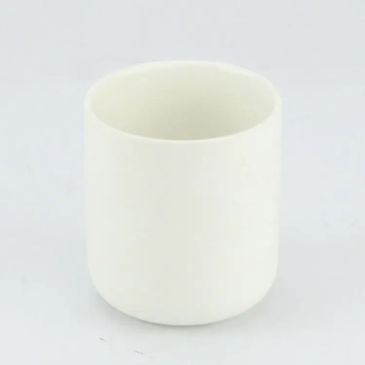 Frosted white unglazed differing sizes ceramic candle jar with lid.JPG