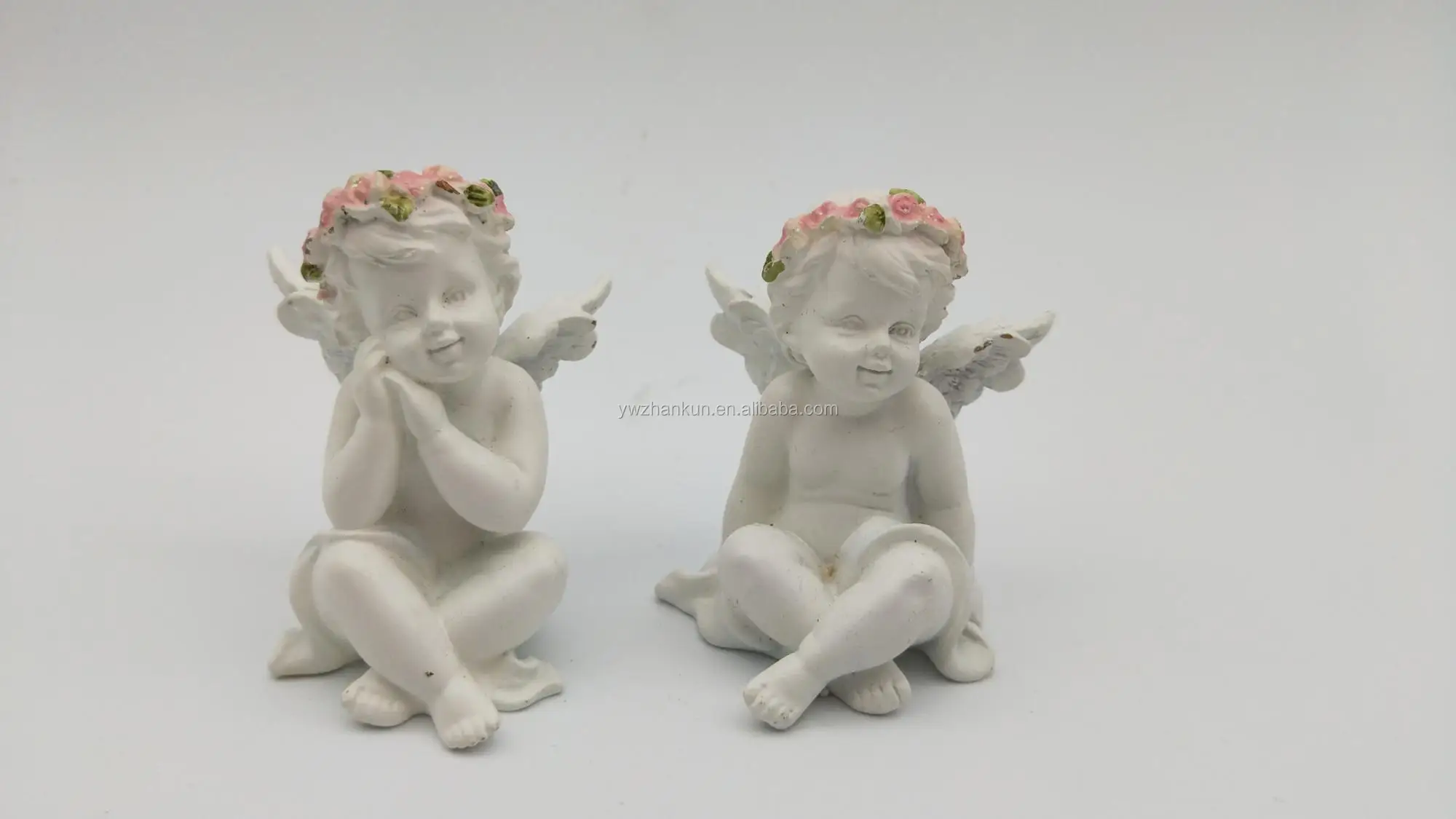 little angel with pink flower cupid polyresin statue