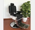 Black barber chair with stainless footrest;Reclining hairdressing chair for beauty salon;Hot sale salon furniture