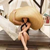 /product-detail/100cm-lady-s-model-fashion-shows-extra-large-wide-brim-wheat-straw-hat-super-fashion-catwalk-super-large-floppy-straw-hat-60830225193.html
