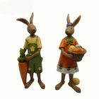 Resin easter decoration holding carrot and eggs rabbit figurines