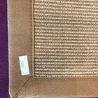 natural fiber jute area carpet with green cotton bind edge