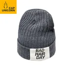 Custom unisex fancy woven letter logo winter hat beanies from china