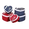 Exquisite snack box paper is earth and heaven shape heart box have red and blue with white bow for nice little gift