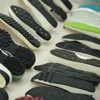 Rubber shoe sole material, soles for shoe making