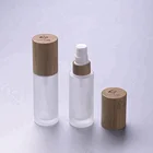 1 ounce clear frosted glass bottle with bamboo top