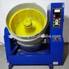 Centrifugal disc polishing machine for metal parts