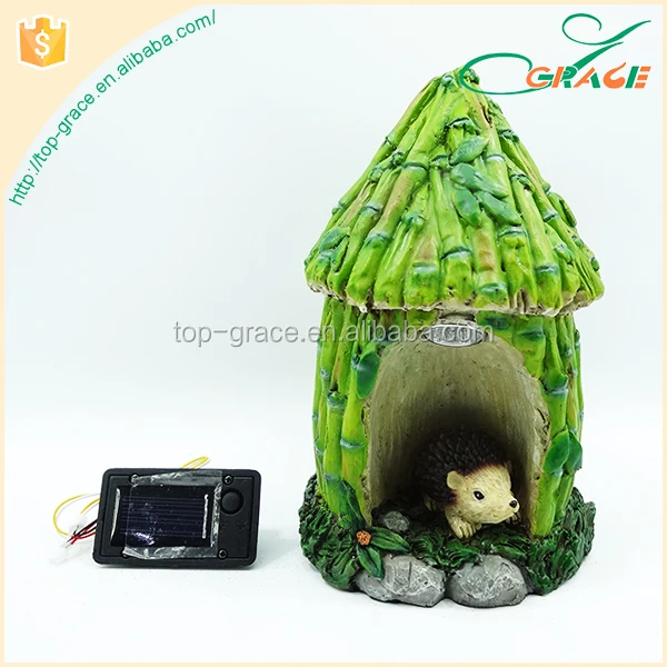 resin hedgehog hid under the bamboo house for garden decoration