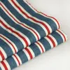 Soft feeling yarn dyed red blue stripe cotton denim look fabric