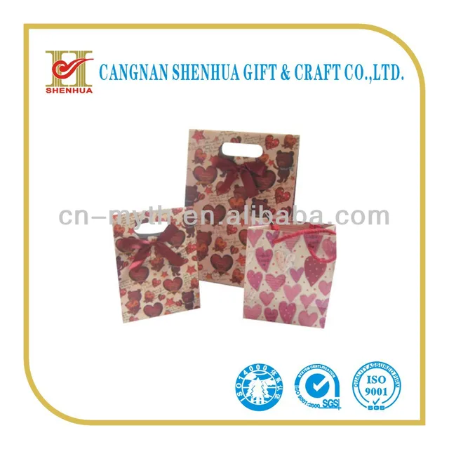 die-cut handle gift brown kraft paper bag with bowknot