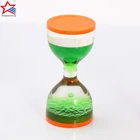 liquid hourglass upward floating hourglass with red sand