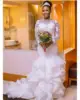 /product-detail/zh2997g-african-nigerian-mermaid-wedding-dresses-bateau-neck-long-illusion-sleeve-lace-appliques-ruffles-organza-bridal-gowns-60772882610.html