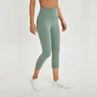 Wholesale 80% nylon 20% spandex nude feeling women's cropped high quality short yoga pants soft and flexible yoga capri