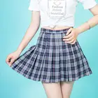 Young beautiful school girl mini pleated plaid short skirt