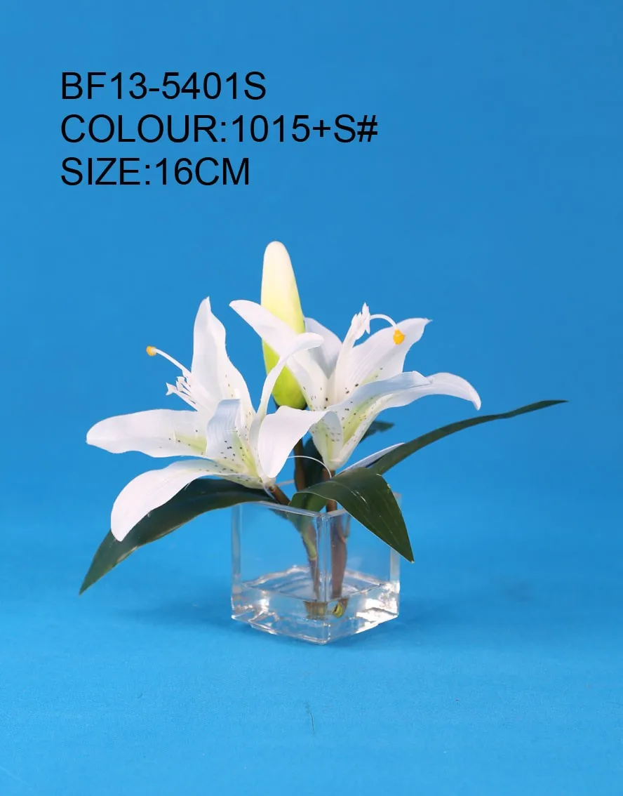 white artificial lily flower with glass vase for wedding