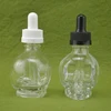 China supplier skull bottle 30ml 15ml empty e-juice skull shape glass dropper bottles for e-cig e-liquid with pipette