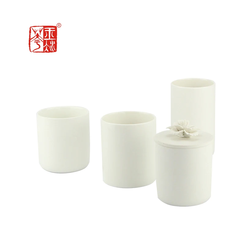 Frosted white unglazed differing sizes ceramic candle jar with lid