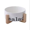 /product-detail/new-design-household-used-white-round-porcelain-ceramic-salad-bowl-with-wood-stand-62187677043.html