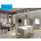 Ladies Fashion Store Stone Counter Table Design Rack Display Clothing Display Fixtures Luxury Metal Clothes Display Rack