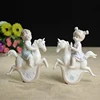 /product-detail/custom-ceramic-boy-and-girl-figurines-with-rocking-horse-60794698734.html