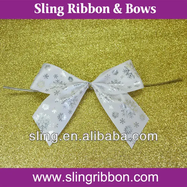 red fancy gift wrap ribbon bow with gold twist tie