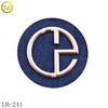 /product-detail/custom-matte-gold-logo-metal-jeans-label-round-garment-sewing-patches-60690056798.html