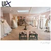 /product-detail/famous-brand-retail-display-rack-furniture-designs-wooden-metal-wedding-dress-stand-60797184232.html