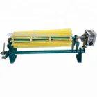 Rotary roller brush for conveyor belt cleaning with replaceable nylon brush strips