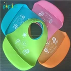 New Design Soft Baby Food Catcher Pocket Roll Up Silicone Bib