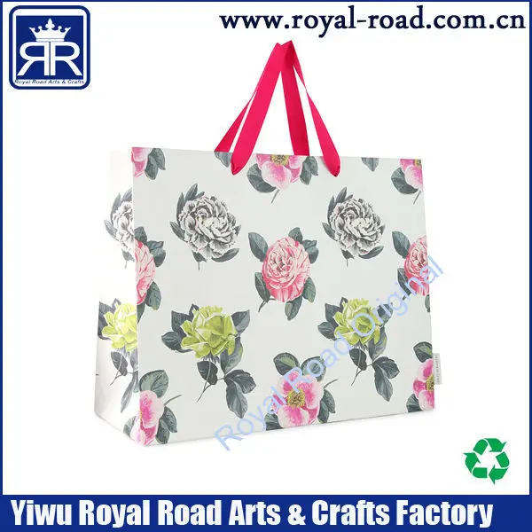 white baby shower paper bag with fabric rope handles fancy