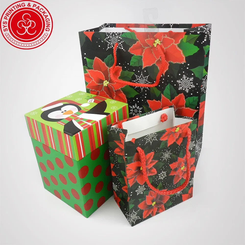 packing custom made merry christmas paper gift bags with handles