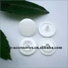 White plastic snap button with four parts for clothing