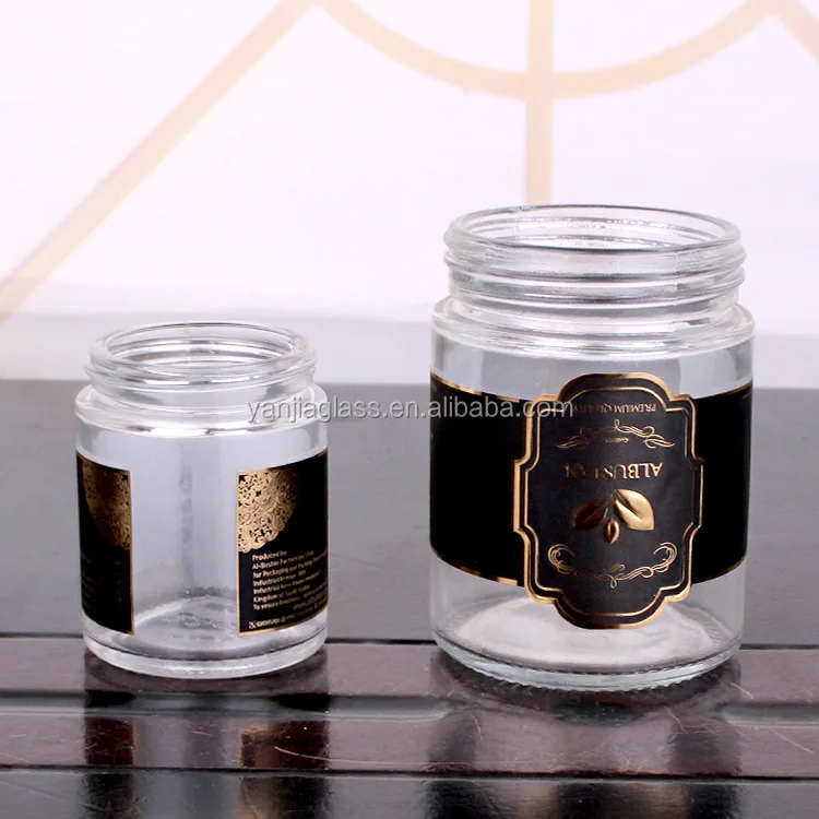cheap cylinder 200ml glass jar with customized logo round glass jar with rose gold lid