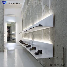 Free design modern acrylic solid surface retail shoes display rack and stand