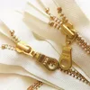 /product-detail/metal-white-ivory-tape-with-brass-teeth-zippers-all-kinds-of-metal-zipper-with-close-end-for-coat-60372744422.html