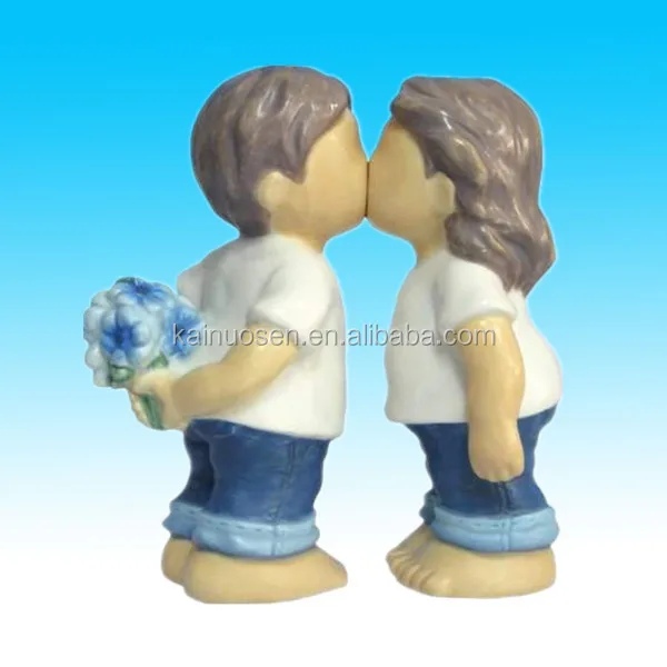 hand painted color glazed ceramic boy and girl statue for sale