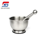 stainless steel mortar and pestle used for mashed garlic and grinding food