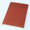Soft cover dot grid notebook with embossed logo