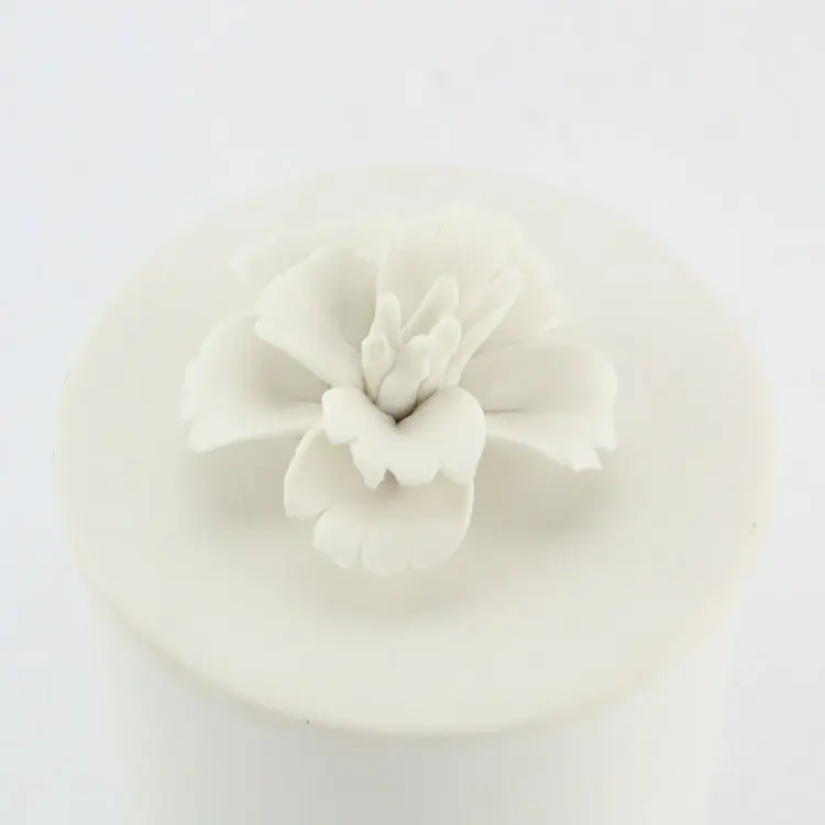 Frosted white unglazed differing sizes ceramic candle jar with lid.JPG
