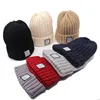 /product-detail/wholesale-custom-ribbed-cable-knit-cuff-beanie-hat-with-woven-label-60818120397.html