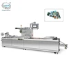 Automatic thermoforming continuous stretch film vacuum packaging machine