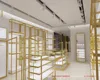Bespoke golden decorated wooden clothing and bag display shelves and rack design for boutique clothing showroom store design