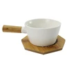 /product-detail/good-heat-resistant-milk-warmer-pot-french-unique-ceramic-white-cookware-with-wooden-handle-60773684575.html