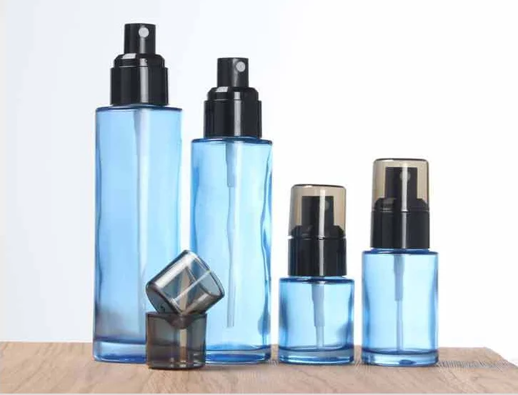 Wholesale 30ml 50ml 100ml transparent blue color Cosmetic packing bottle set bottle cream container for luxury skin care