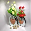 /product-detail/flat-round-glass-vase-for-flowers-made-in-china-60637587515.html