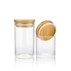 /product-detail/borosilicate-500-1800ml-round-shape-glass-jar-vials-with-cork-lid-and-wooden-top-62017624913.html