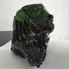 large dark green glass rock